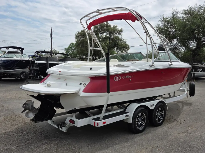 Slide: The Image of 2008 Cobalt 220 boat with red and white design on a trailer. - 4