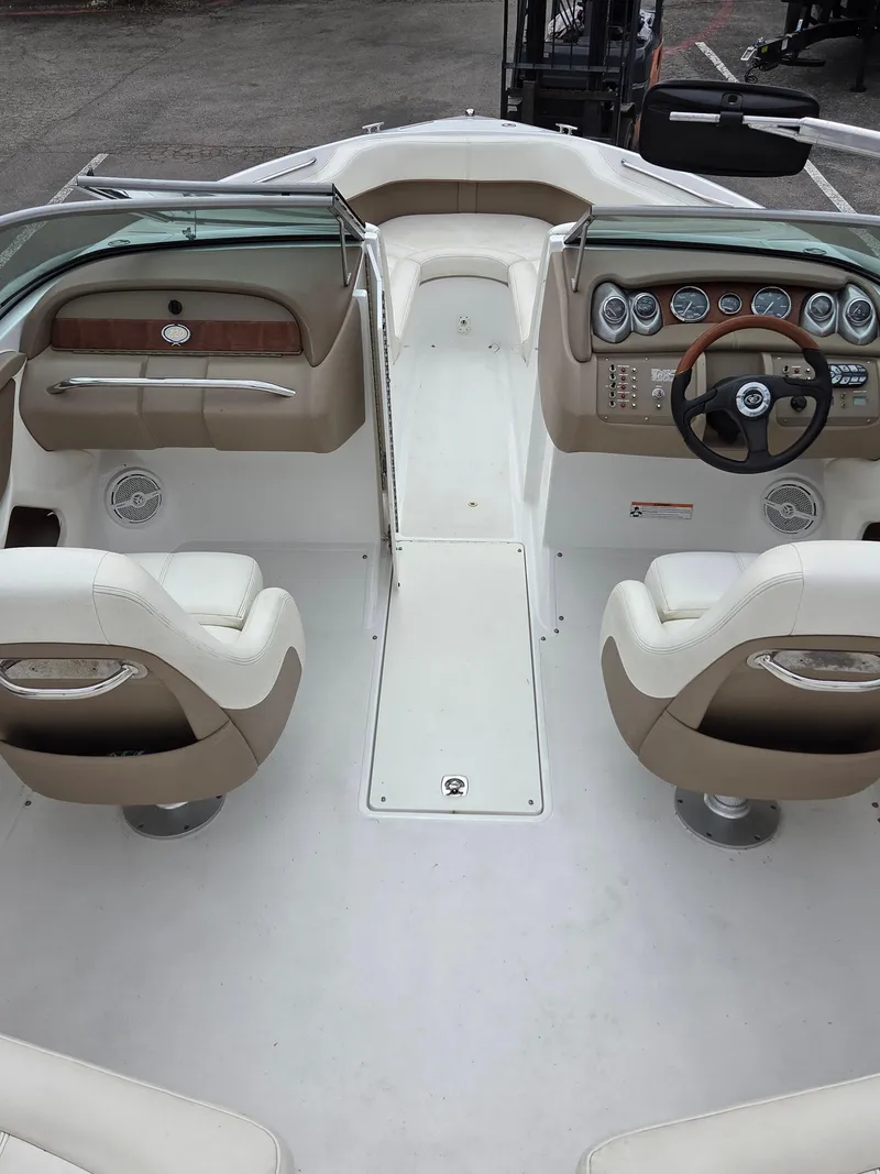 Slide: The Image of 2008 Cobalt 220 boat interior with dual seats and dashboard controls. - 8