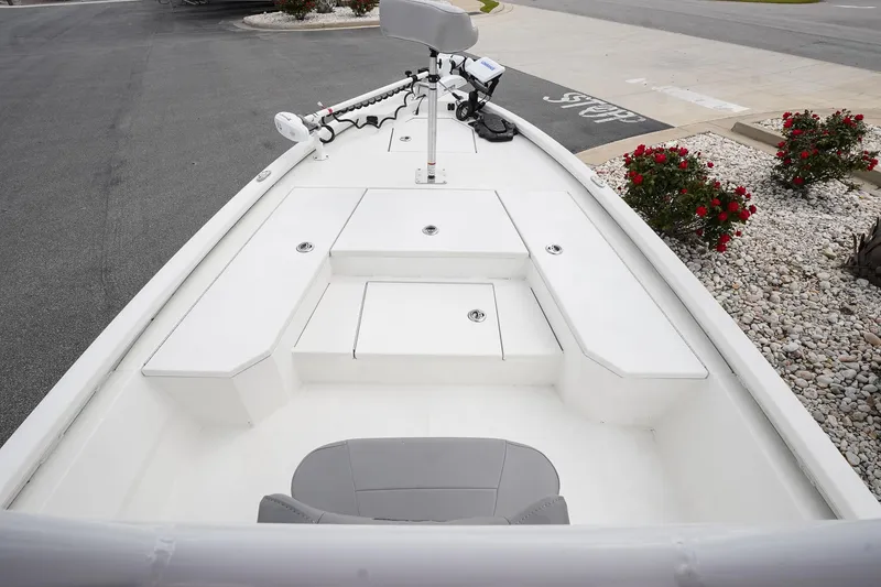Slide: The Image of 2022 Avid 21 FS boat deck with storage compartments and seating. - 10