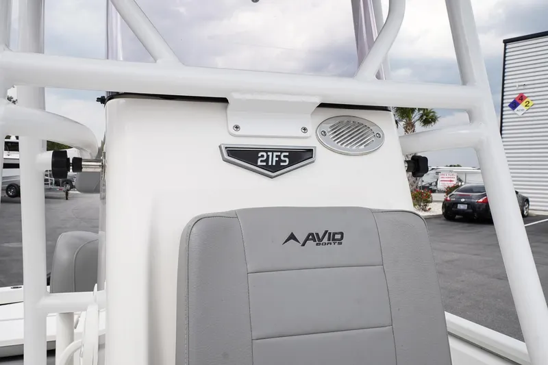 Slide: The Image of 2022 Avid 21 FS boat interior with branded seating and console details. - 16