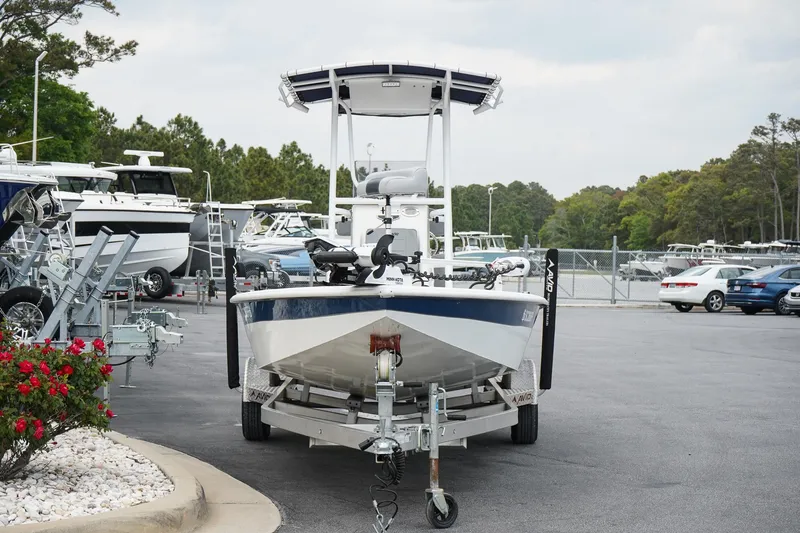 Slide: The Image of 2022 Avid 21 FS boat on trailer in marina parking lot. - 3