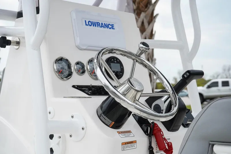 Slide: The Image of Control panel of 2022 Avid 21 FS boat with Lowrance system and steering wheel. - 5