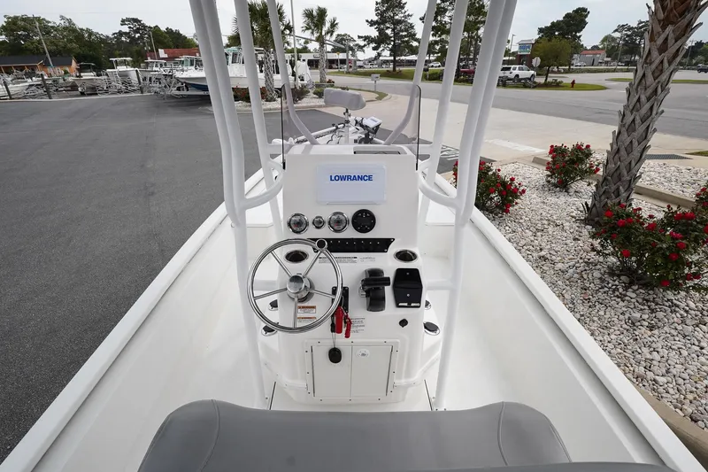 Slide: The Image of 2022 Avid 21 FS boat console with steering wheel and navigation equipment. - 9