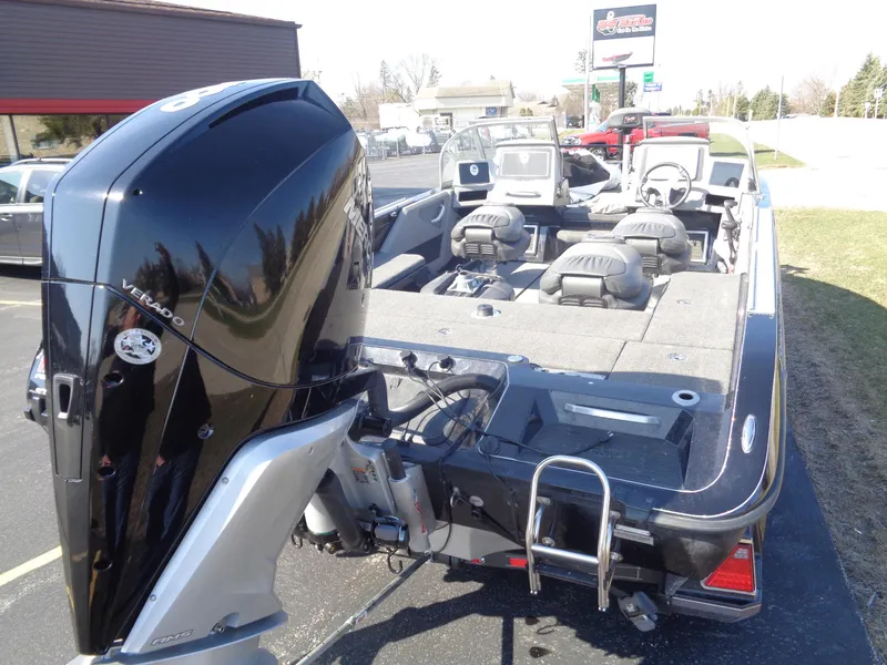 Slide: The Image of 2023 Ranger 621FS Pro boat with powerful outboard motor, parked outdoors. - 10