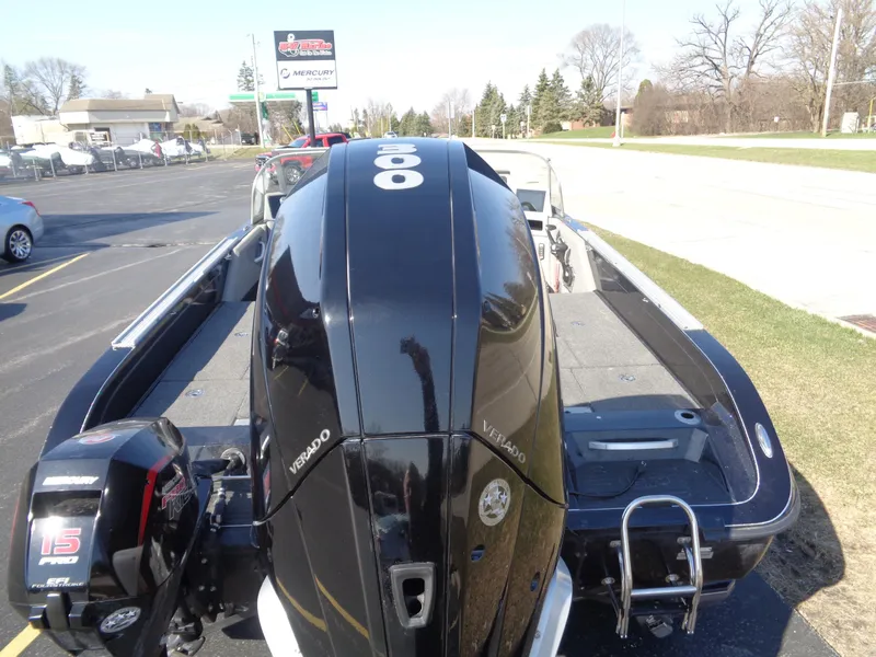 Slide: The Image of 2023 Ranger 621FS Pro boat with powerful outboard motor, parked on a sunny day. - 11