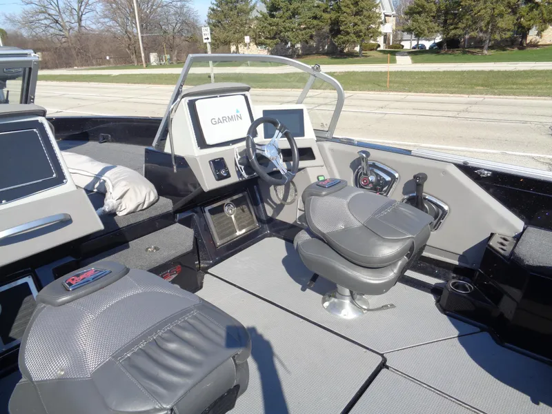 Slide: The Image of 2023 Ranger 621FS Pro boat interior with Garmin navigation system and comfortable seating. - 13