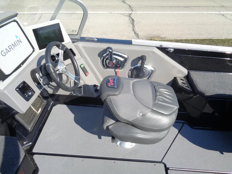 Slide: The Image of 2023 Ranger 621FS Pro boat cockpit with Garmin system and comfortable seating. - 14