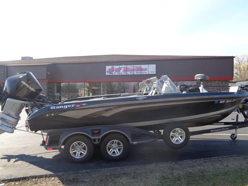 Slide: The Image of 2023 Ranger 621FS Pro boat on trailer, parked outside a building. - 6
