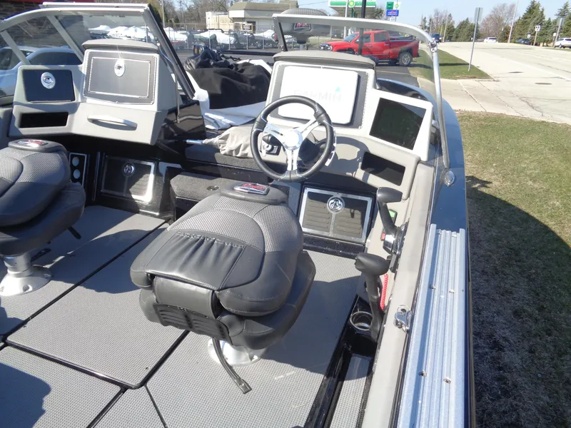 Slide: The Image of 2023 Ranger 621FS Pro boat interior with steering wheel and seating. - 7