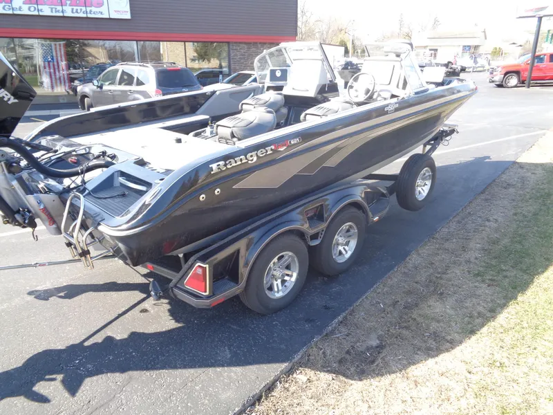 Slide: The Image of 2023 Ranger 621FS Pro boat on trailer, parked outdoors in a lot. - 9
