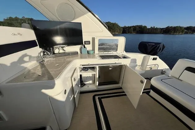 Slide: The Image of Luxurious 2010 Sea Ray 450 Sundancer yacht interior with modern amenities and scenic lake view. - 18