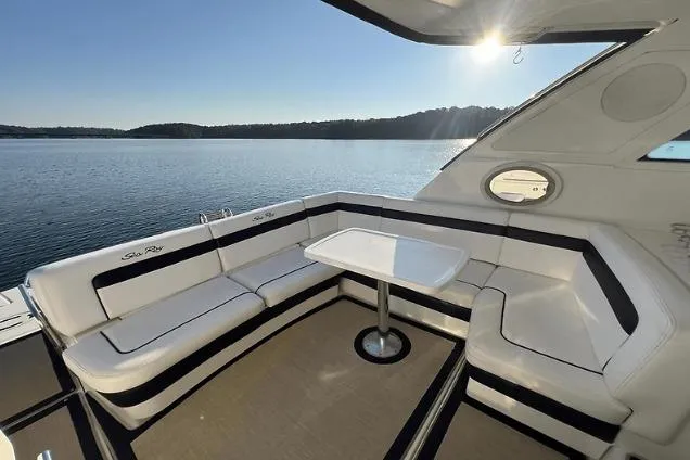 Slide: The Image of Luxurious 2010 Sea Ray 450 Sundancer yacht interior with elegant seating and table. - 22
