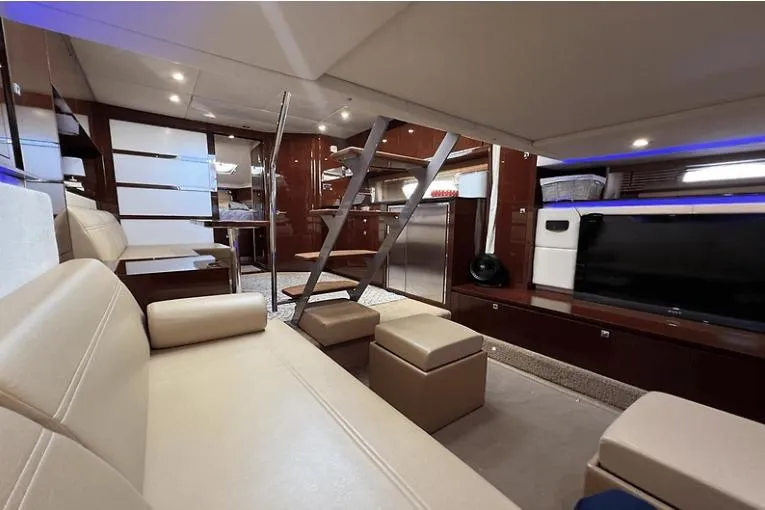 Slide: The Image of Luxurious interior of 2010 Sea Ray 450 Sundancer yacht with modern furnishings and sleek design. - 24