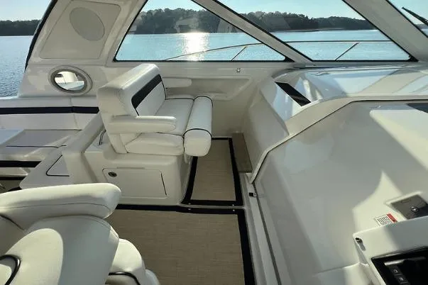 Slide: The Image of Interior of 2010 Sea Ray 450 Sundancer yacht with luxurious seating and scenic water view. - 25