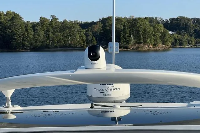 Slide: The Image of Sea Ray 450 Sundancer 2010 with TracVision satellite, cruising on a serene lake. - 39