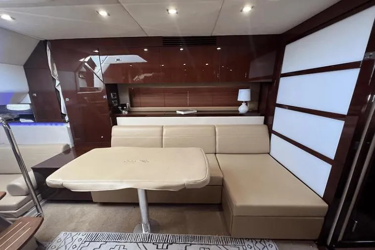 Slide: The Image of Luxurious interior of 2010 Sea Ray 450 Sundancer yacht with beige seating and modern decor. - 42