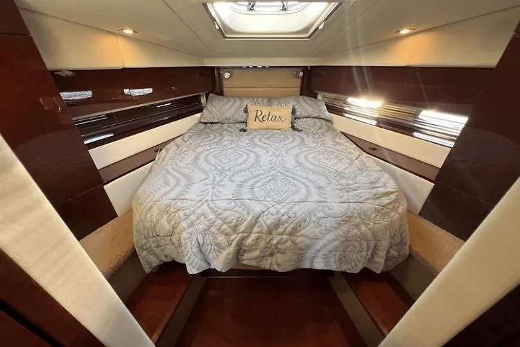 Slide: The Image of Luxurious cabin interior of 2010 Sea Ray 450 Sundancer yacht with cozy bed. - 48
