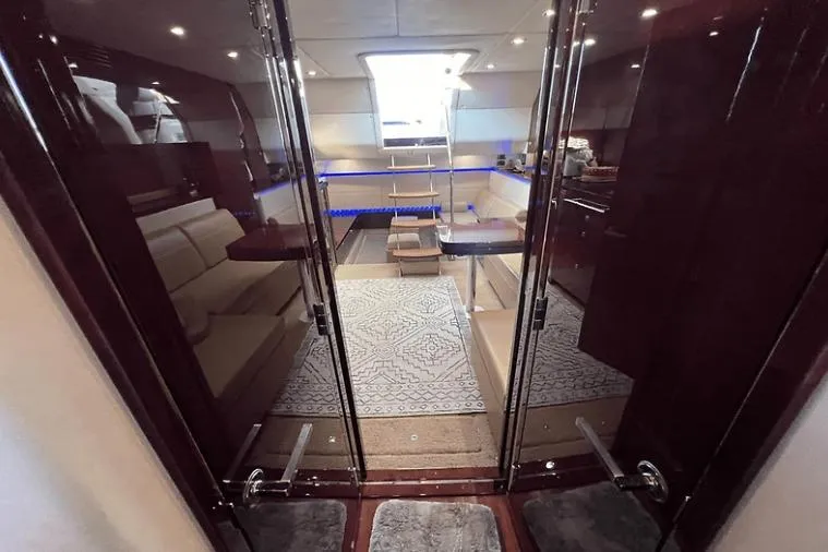 Slide: The Image of Luxurious interior of 2010 Sea Ray 450 Sundancer yacht with elegant seating and modern design. - 53