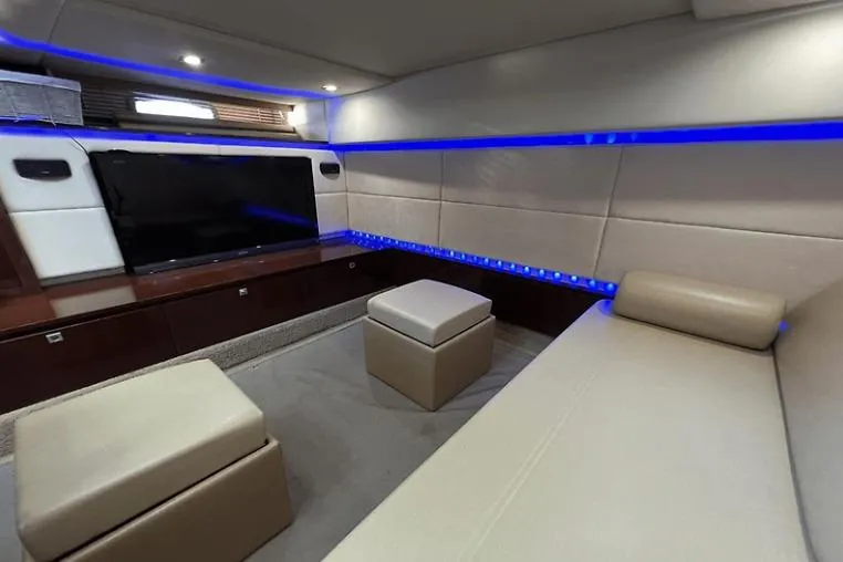 Slide: The Image of Luxurious interior of 2010 Sea Ray 450 Sundancer with modern seating and ambient lighting. - 58