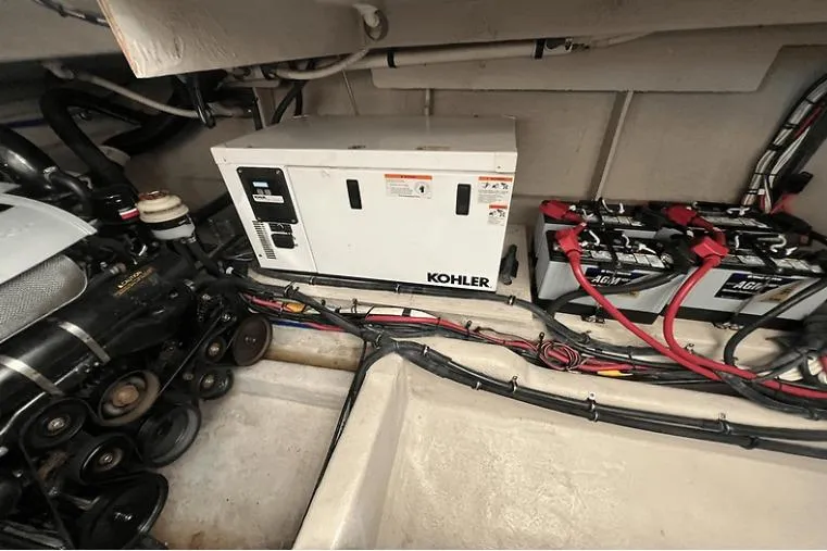 Slide: The Image of Engine room of 2010 Sea Ray 450 Sundancer with Kohler generator and AGM batteries. - 61