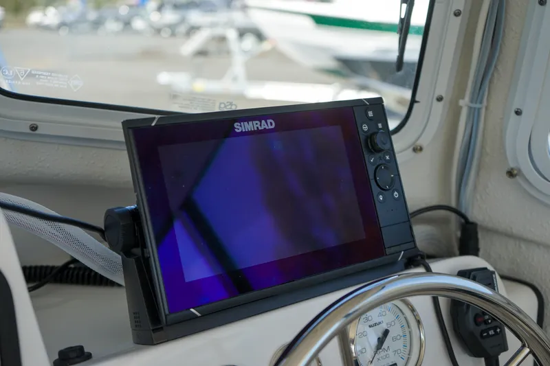 Slide: The Image of Simrad navigation system on 2022 C-Dory 22' Cruiser boat dashboard. - 11