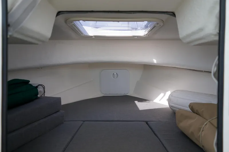 Slide: The Image of Interior cabin of 2022 C-Dory 22' Cruiser with skylight and cushions. - 17
