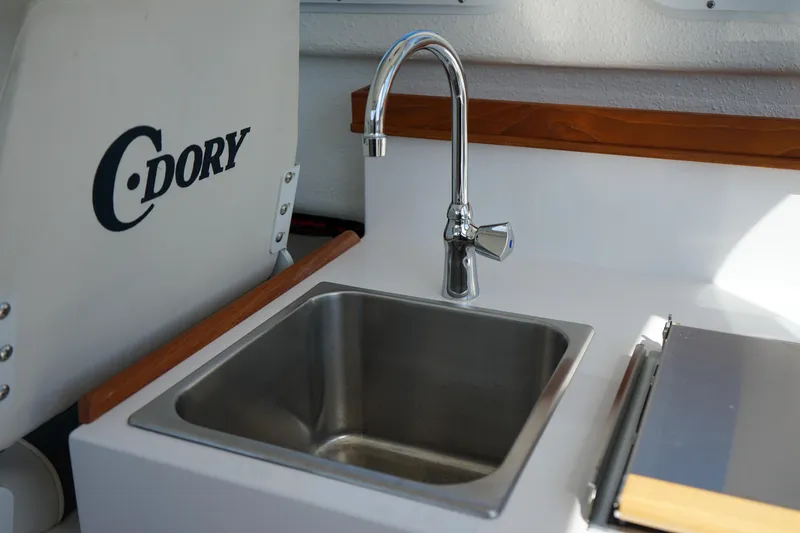 Slide: The Image of C-Dory 22' Cruiser 2022 model featuring a sleek stainless steel sink and faucet. - 20