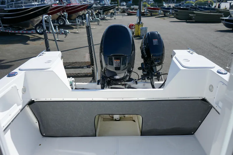 Slide: The Image of 2022 C-Dory 22' Cruiser boat with dual outboard motors in a marina setting. - 7
