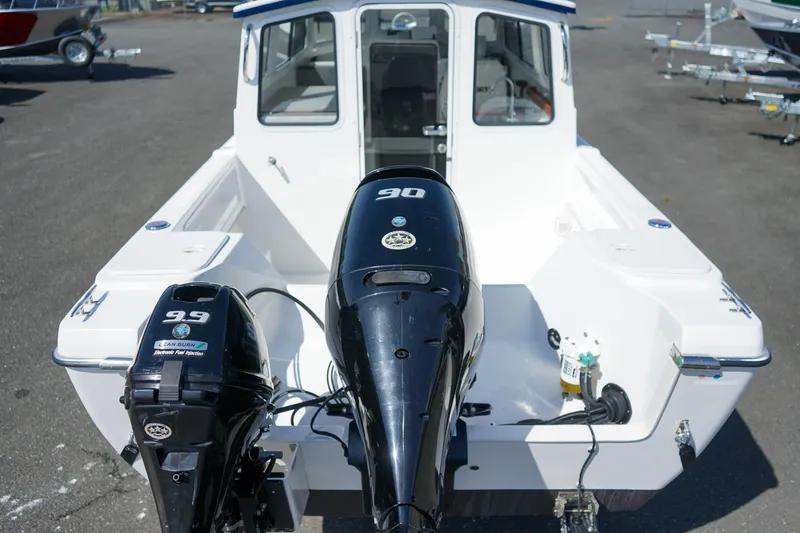 Slide: The Image of 2022 C-Dory 22' Cruiser with dual outboard motors, viewed from the rear. - 8