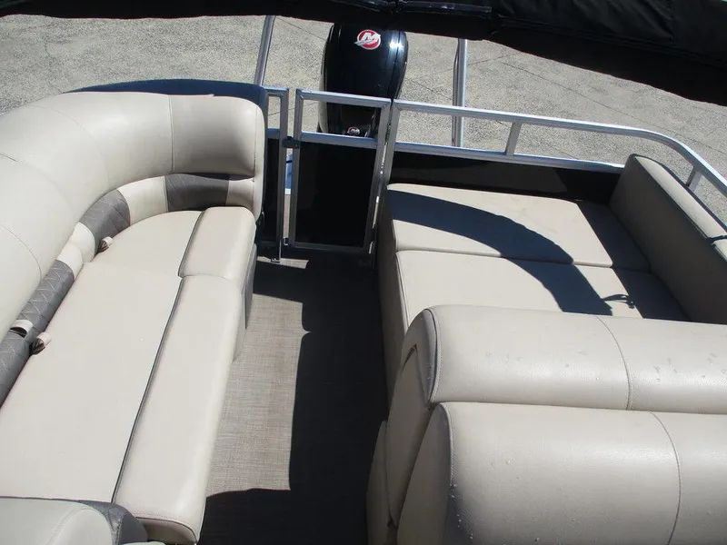 Slide: The Image of 2020 Sun Tracker PARTY BARGE® 22 RF DLX interior with beige seating and spacious layout. - 5