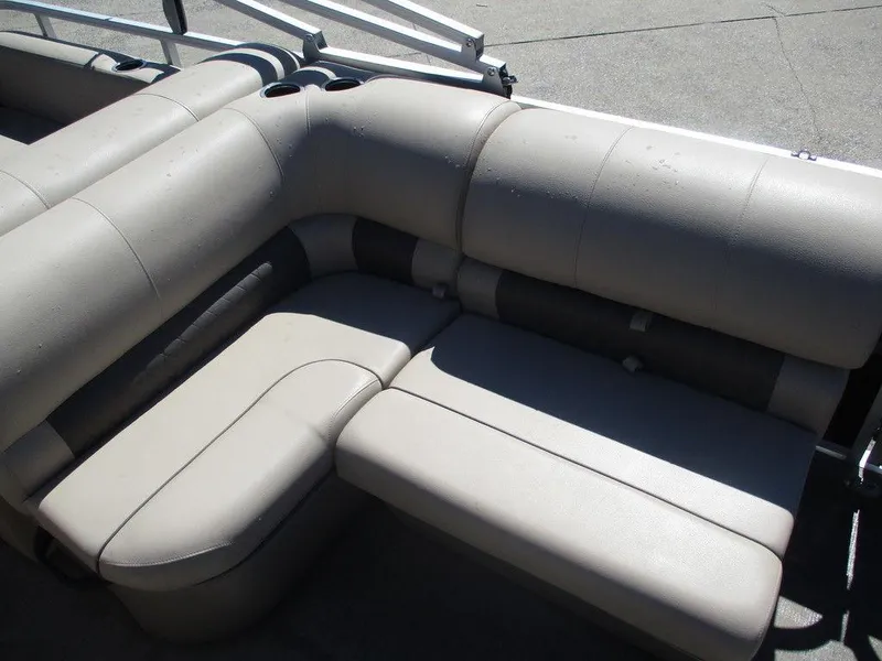Slide: The Image of 2020 Sun Tracker PARTY BARGE® 22 RF DLX pontoon boat seating, beige upholstery, L-shaped design. - 8