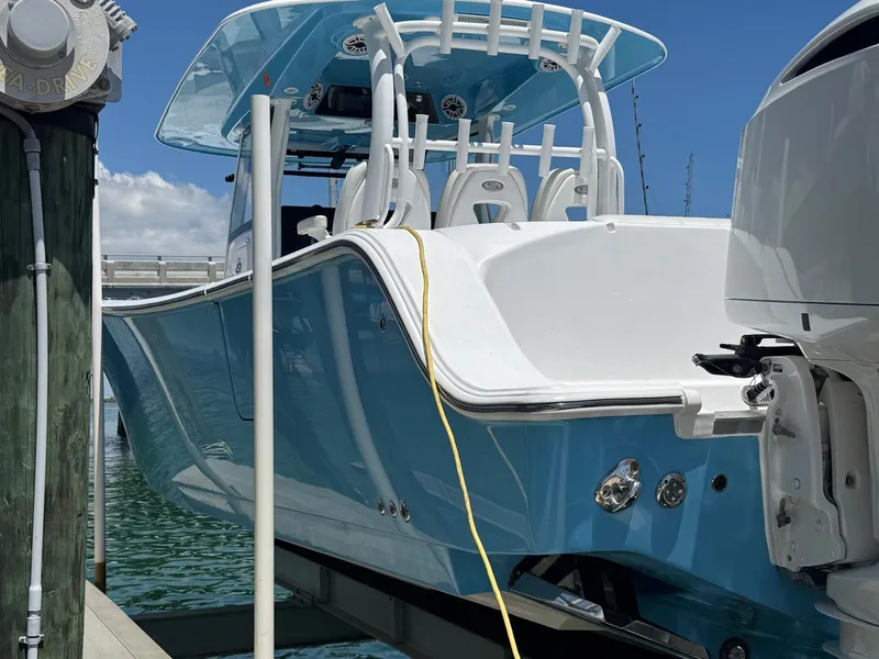 Slide: The Image of 2020 Sportsman Open 352 Center Console boat docked, showcasing sleek design and modern features. - 22