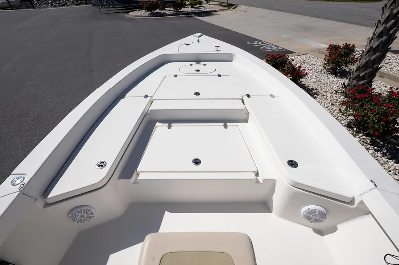 Slide: The Image of Bow view of a 2013 Pathfinder 2400 TRS boat, featuring storage compartments. - 15
