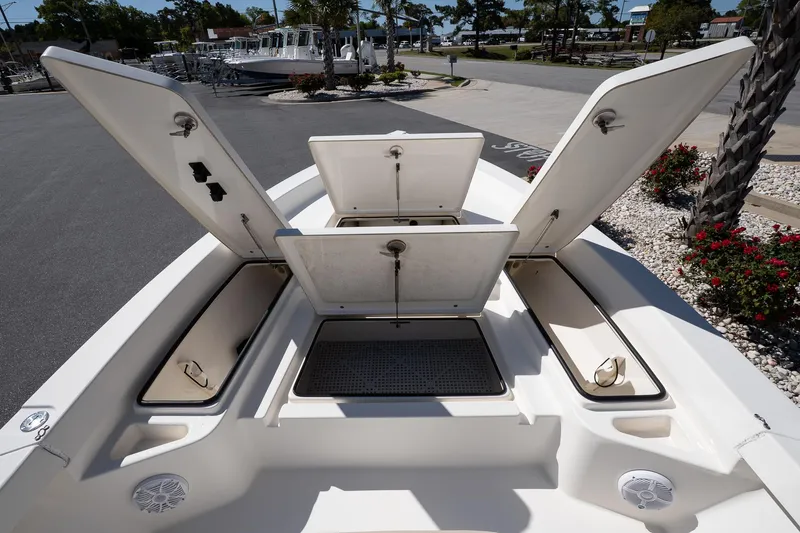 Slide: The Image of 2013 Pathfinder 2400 TRS boat with open storage compartments on deck. - 16