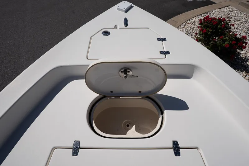 Slide: The Image of Bow storage compartment on a 2013 Pathfinder 2400 TRS boat, open and empty. - 18