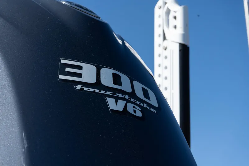 Slide: The Image of Outboard motor with "300 fourstroke V6" label on a 2013 Pathfinder 2400 TRS boat. - 23