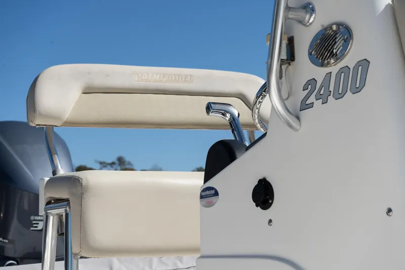 Slide: The Image of 2013 Pathfinder 2400 TRS boat interior with seating and console details. - 25