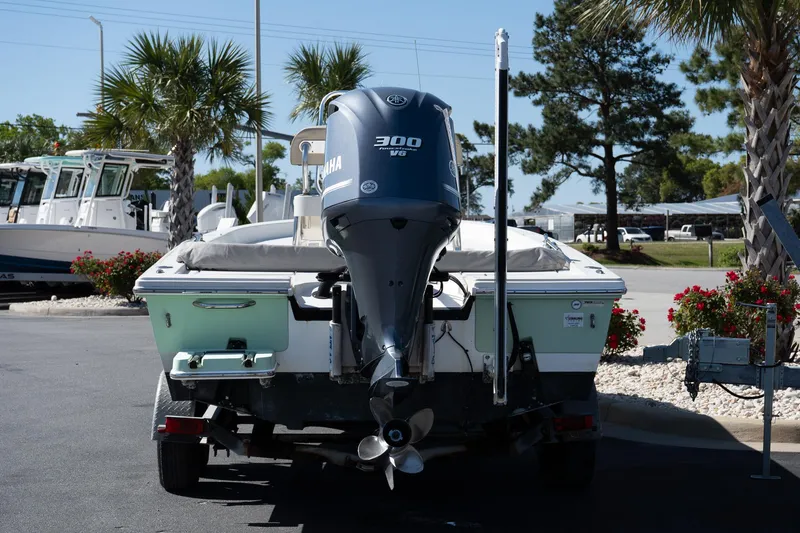 Slide: The Image of 2013 Pathfinder 2400 TRS boat with Yamaha 300 HP engine, parked outdoors. - 4