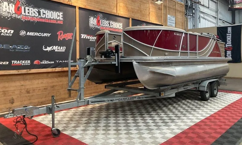Slide: The Image of 2016 South Bay 521 FCR pontoon boat on trailer in showroom. - 5