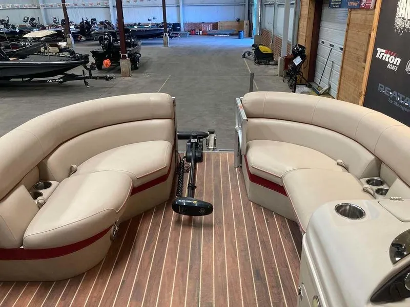 Slide: The Image of 2016 South Bay 521 FCR pontoon boat interior with beige seating and wood flooring. - 8