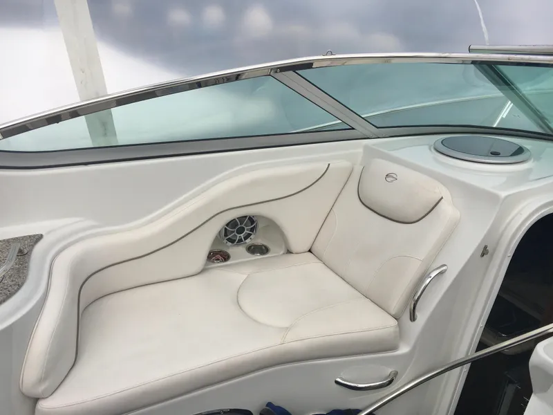 Slide: The Image of 2018 Crownline 264 CR boat interior with white seating and sleek design. - 12