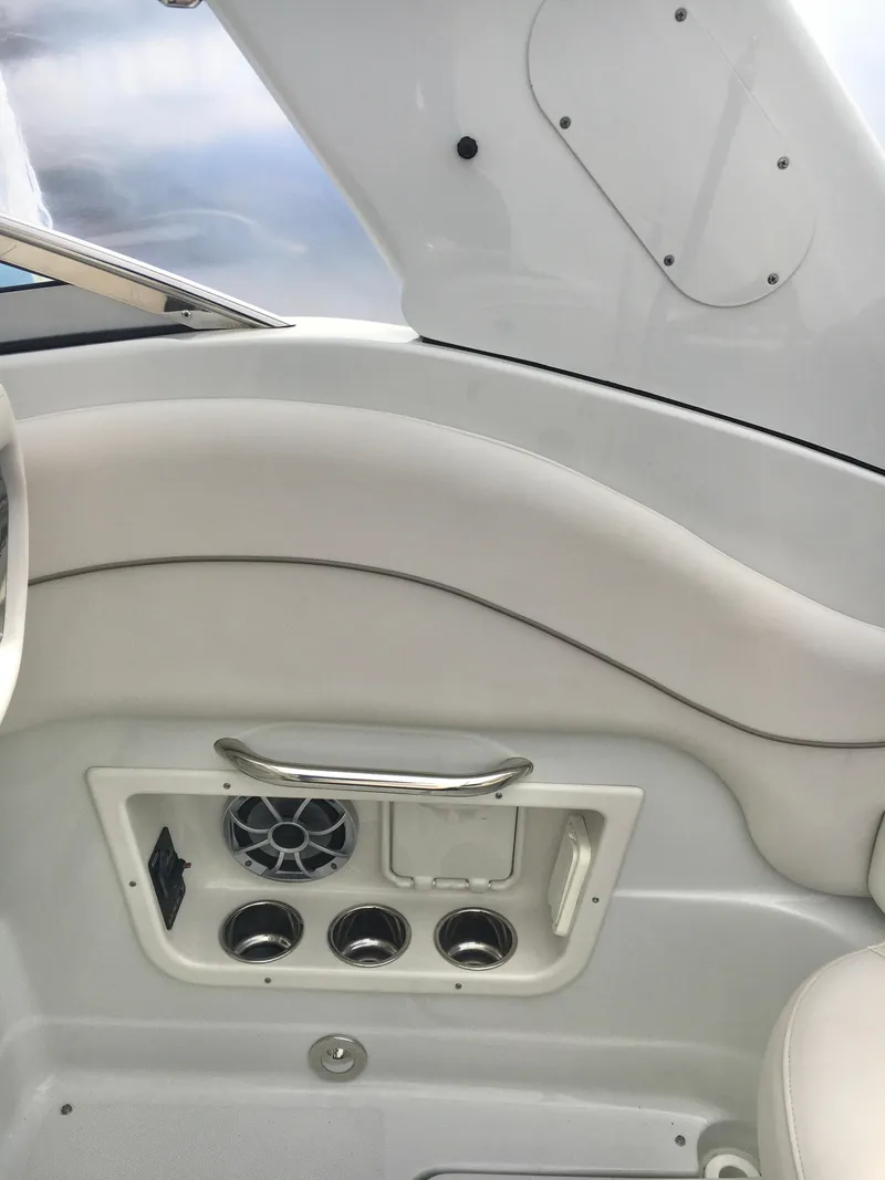 Slide: The Image of 2018 Crownline 264 CR boat interior with speaker and ventilation system. - 14