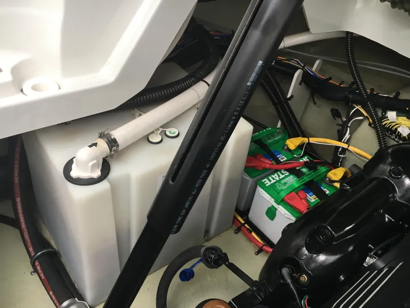 Slide: The Image of Engine compartment of a 2018 Crownline 264 CR boat, showing battery and wiring. - 30
