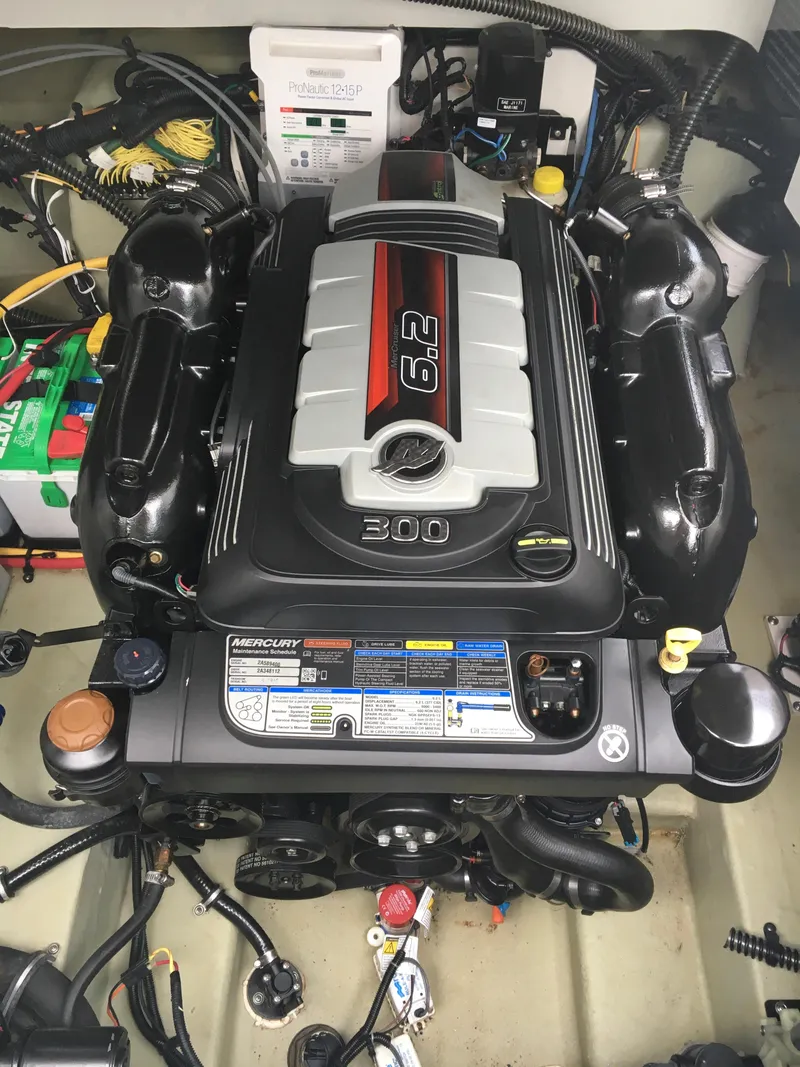 Slide: The Image of 2018 Crownline 264 CR engine compartment with 6.2L engine and battery setup. - 33