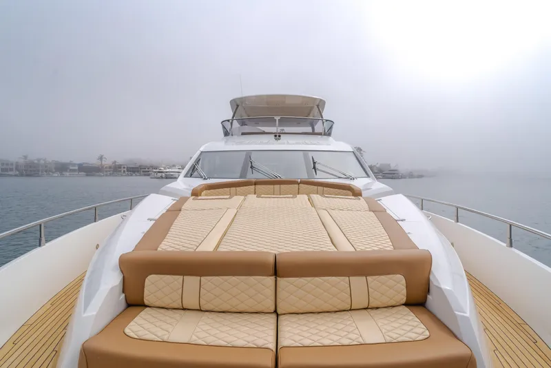 Slide: The Image of 2017 Sunseeker 75 Yacht with luxurious deck seating on a foggy day. - 15
