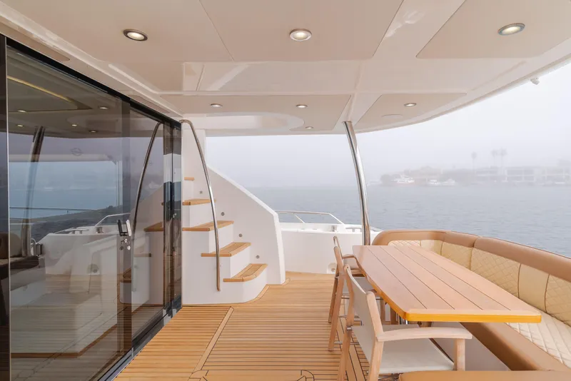 Slide: The Image of Luxurious Sunseeker 75 Yacht 2017 with elegant deck and seating area overlooking the water. - 17