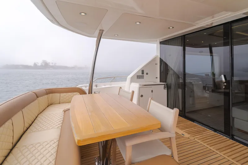 Slide: The Image of Luxurious Sunseeker 75 Yacht 2017 with elegant outdoor seating and ocean view. - 18