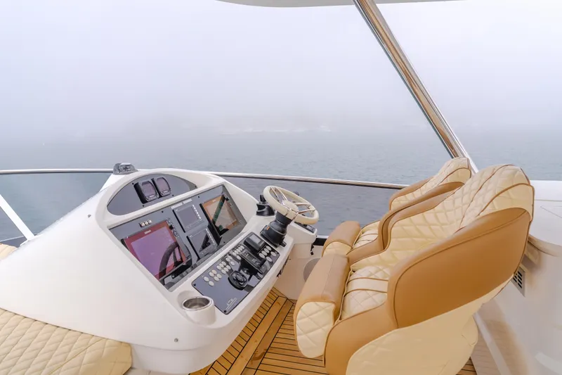 Slide: The Image of Luxurious helm of 2017 Sunseeker 75 Yacht with leather seating and advanced controls. - 19
