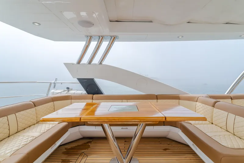 Slide: The Image of Luxurious seating area on 2017 Sunseeker 75 Yacht with elegant wood table. - 22