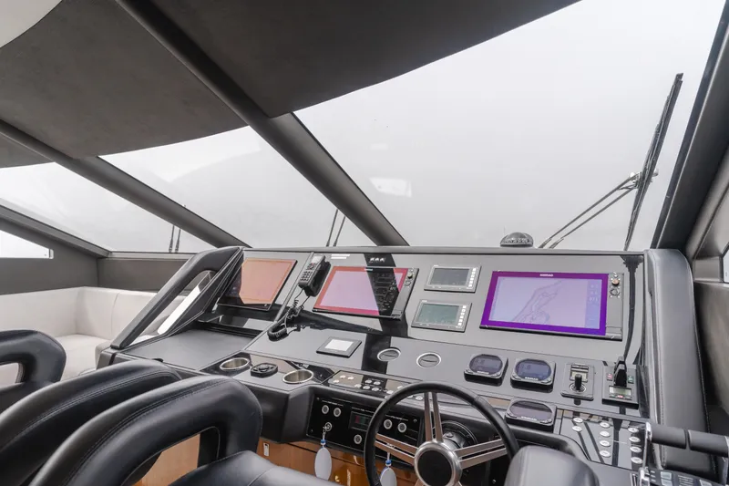 Slide: The Image of Control panel of a 2017 Sunseeker 75 Yacht with modern navigation equipment. - 26